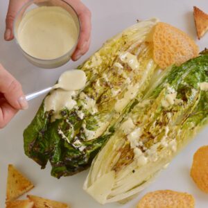 Grilled Romaine Hearts Caesar Salad with gluten free croutons and Parmesan cheese wafers