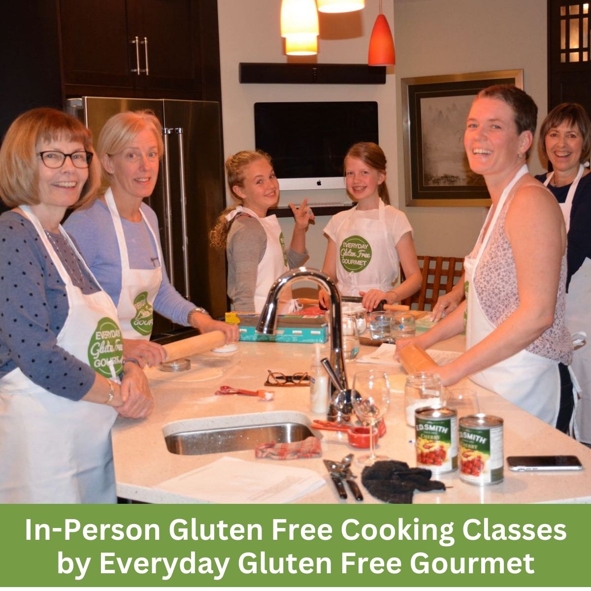 The Everyday Gluten Free Gourmet kitchen with 6 people around the island making gluten free pastry.