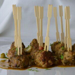Meatballs in Almond Sauce served as an appetizer with toothpicks