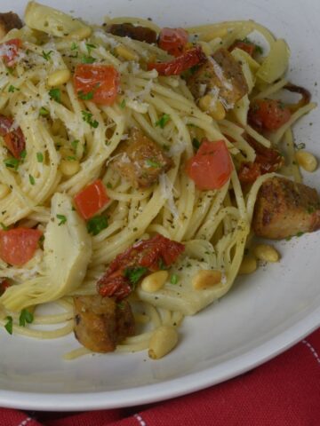 A bowl of gluten free pasta tossed with Sausage and Vegetables.