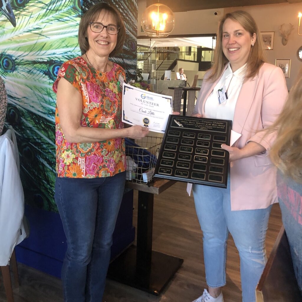 Cinde standing with Lisa Cerato of the Calgary Chapter of the Celiac Association, receiving her award for Volunteer of the Year 2024.