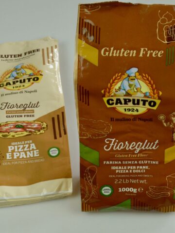 Two different packages of Caputo brand flour containing certified gluten free wheat starch.