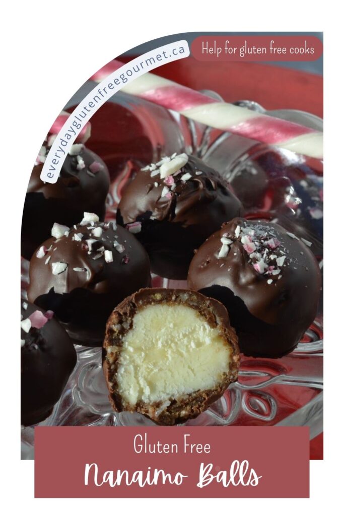 A tray of gluten free Nanaimo Balls sprinkled with crushed candy canes and a whole candy cane beside it.