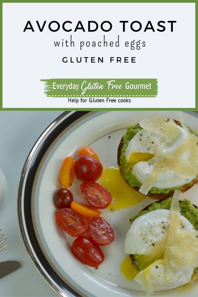 Two poached Eggs on Avocado Toast topped with shaved Parmesan plus cherry tomatoes on the side.