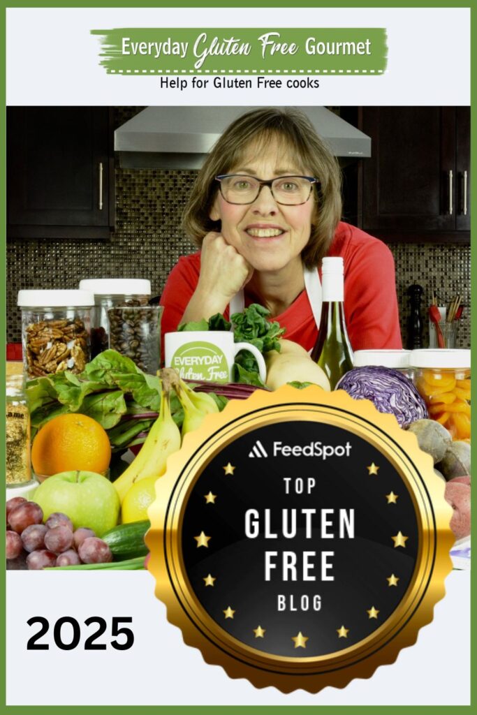 Cinde in her kitchen surrounded by an array of 30+ fruits, vegetables, legumes, nuts, seeds and more.