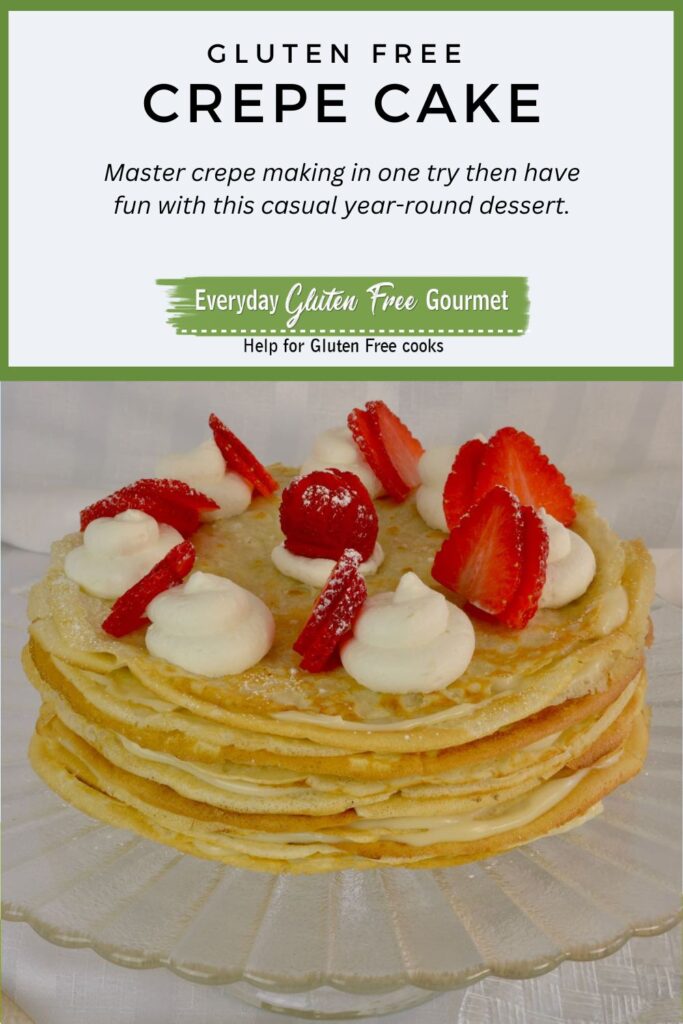 A gluten free Crepe Cake Filled with Pastry Cream decorated with whipped cream and fresh strawberries.