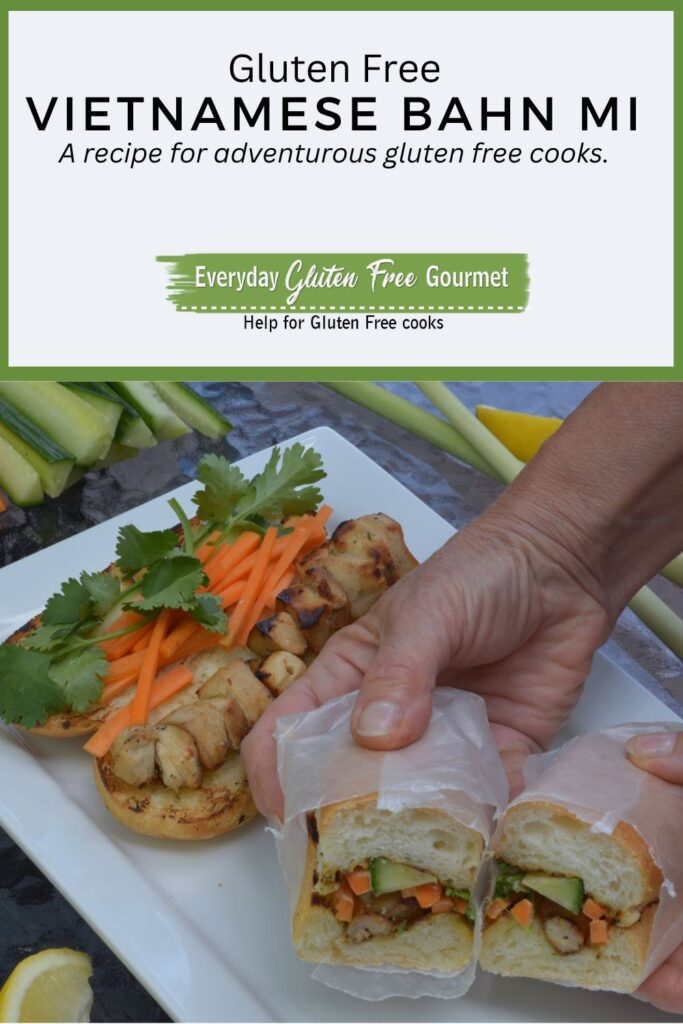 Someone holding a wax-paper wrapped Vietnamese Bahn Mi sandwich filled with chicken, carrot, cucumber and cilantro.