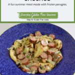 A bowl of Gluten Free Grilled Perogies with Sausage and onions, all grilled and tossed with a mustard dressing.