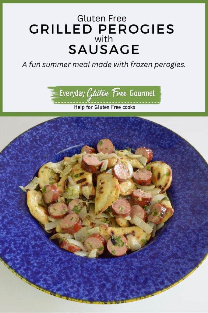 A bowl of Gluten Free Grilled Perogies with Sausage and onions, all grilled and tossed with a mustard dressing.