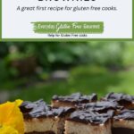 A pedestal tray with gluten free Mocha Cheesecake Brownies decorated with pansies.