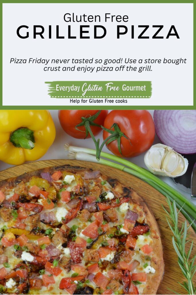 A cooked gluten free Grilled Sausage and Vegetable Pizza surrounded by peppers, tomatoes and onion.