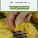 A rack of Brazilian cheese buns with someone pulling one bun apart to show the chewiness.