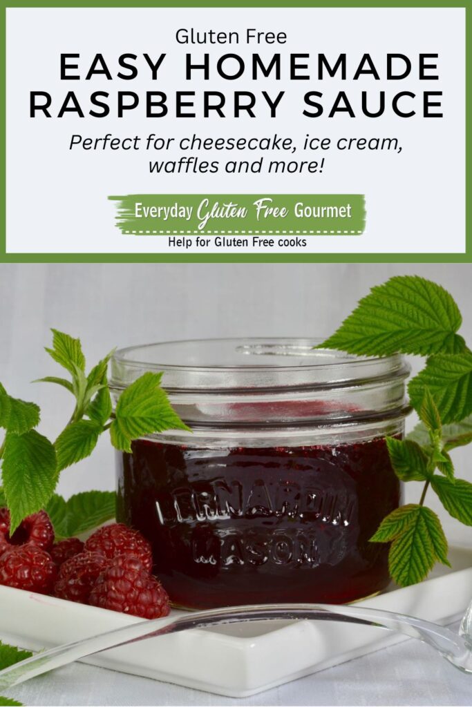 A Mason jar of an easy homemade Raspberry Sauce surrounded by raspberry branches and fresh berries with a ladle to serve it.