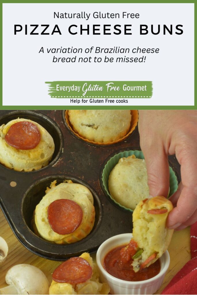 Gluten free Pepperoni Pizza Cheese Buns in a muffin pan, and a hand dipping one bun into a dish of pizza sauce.