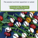A tray of tomato, bocconcini & basil skewers drizzled with balsamic glaze.
