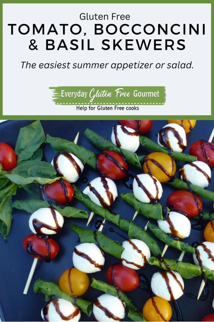 A tray of tomato, bocconcini & basil skewers drizzled with balsamic glaze.
