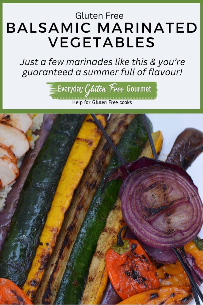 A plate of Balsamic Marinated Grilled Vegetables including green and yellow zucchini, eggplant, peppers and red onion.