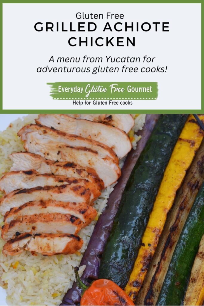 Slices of grilled Achiote Chicken on a bed of rice beside grilled summer squash and red onion.