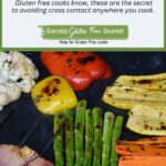 A reusable grilling sheet on the barbecue covered with cooked vegetables that all show nice grill marks.