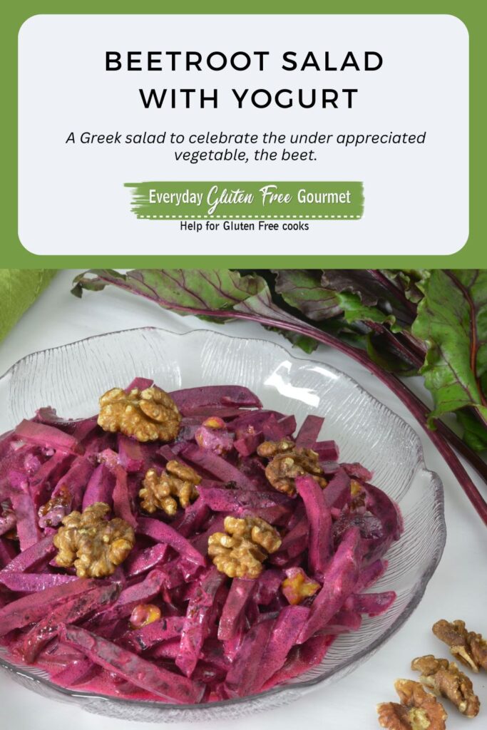 A bowl of Beet Salad with yogurt dressing and topped with walnuts.