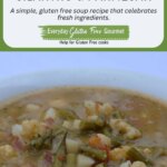 A bowl of Green Bean Soup with potatoes, cauliflower, cilantro and Parmesan cheese.