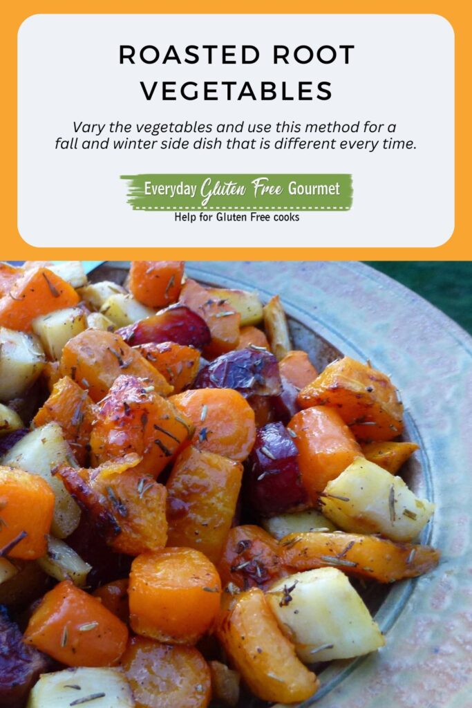 A serving dish of naturally gluten free roasted root vegetables including carrots, potatoes, beets and turnips.