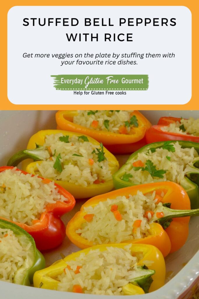 A baking dish of halved bell peppers showing the rice filling.