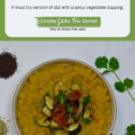 A bowl of Yellow Split Pea Dal topped with sauteed zucchini, tomato and spices.