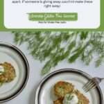 Two plates of gluten free Pan Fried Zucchini Fritters topped with sour cream and garnished with fresh dill.