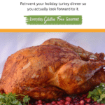 A whole Achiote Butter Basted Turkey on a platter surrounded by cranberries and cilantro.