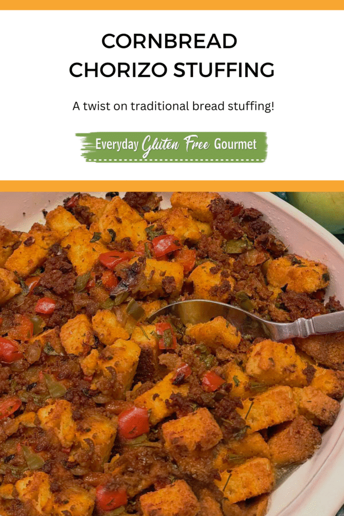 A casserole dish of gluten free Cornbread Chorizo Stuffing surrounded by apples.