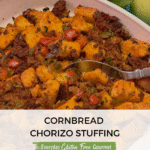 A casserole dish of gluten free Cornbread Chorizo Stuffing surrounded by apples.