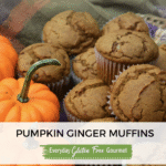 A basket of gluten free Pumpkin Ginger Muffins beside orange mini pumpkins.