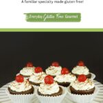 A pedestal tray with Black Forest Cupcakes, each topped with a maraschino cherry.
