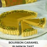 A gluten free Bourbon Caramel Pumpkin Tart on a platter with two pieces cut.