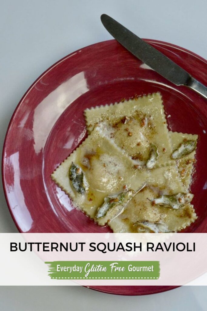 A bowl of gluten free butternut squash ravioli with a knife and fork beside it.