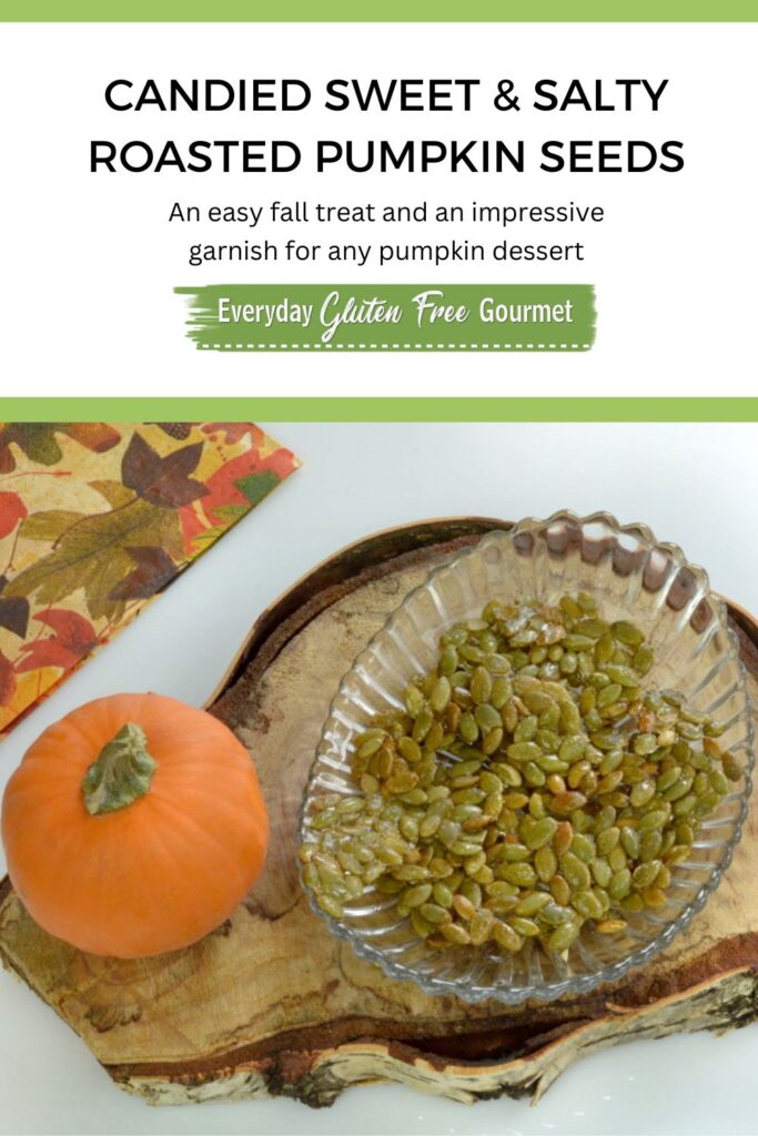 A bowl of Candied Sweet and Salty Pumpkin Seeds beside a mini pumpkin.