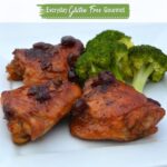 Three thigh pieces of gluten free Cranberry Orange Chicken and steamed broccoli.