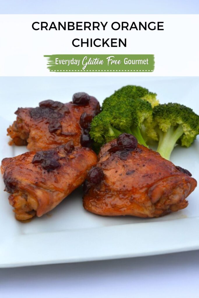 Three thigh pieces of gluten free Cranberry Orange Chicken and steamed broccoli.