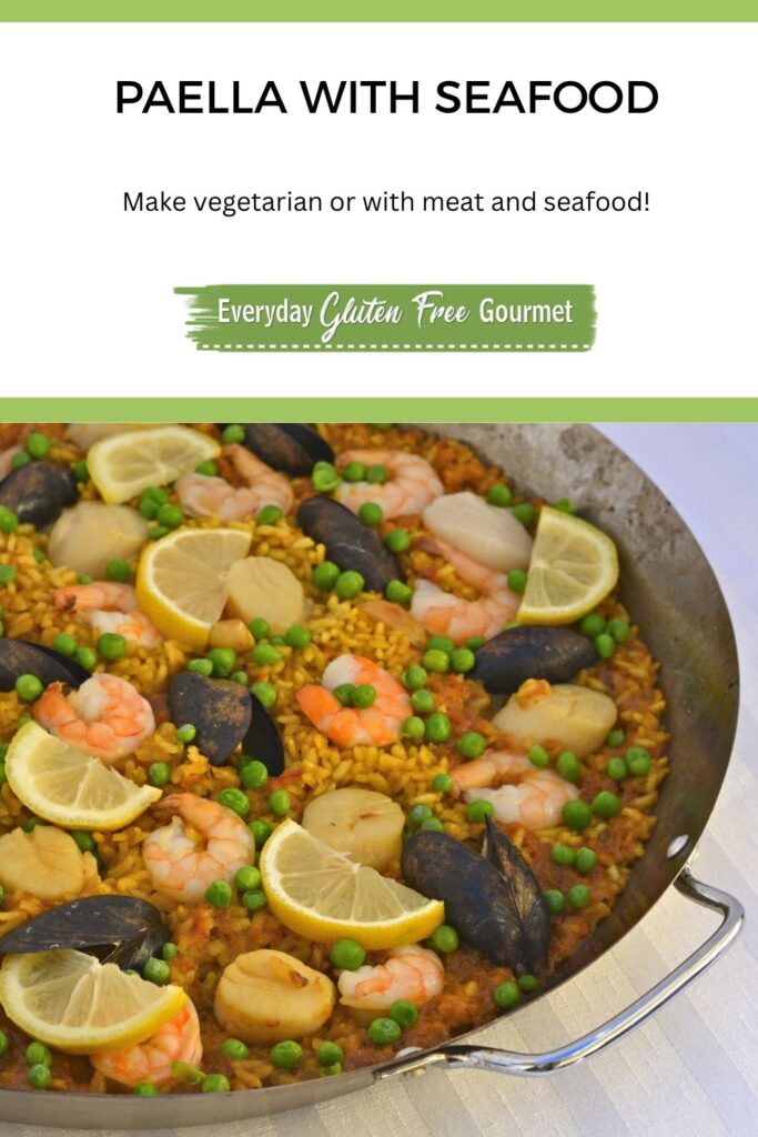 A paella pan filled with Paella with Seafood