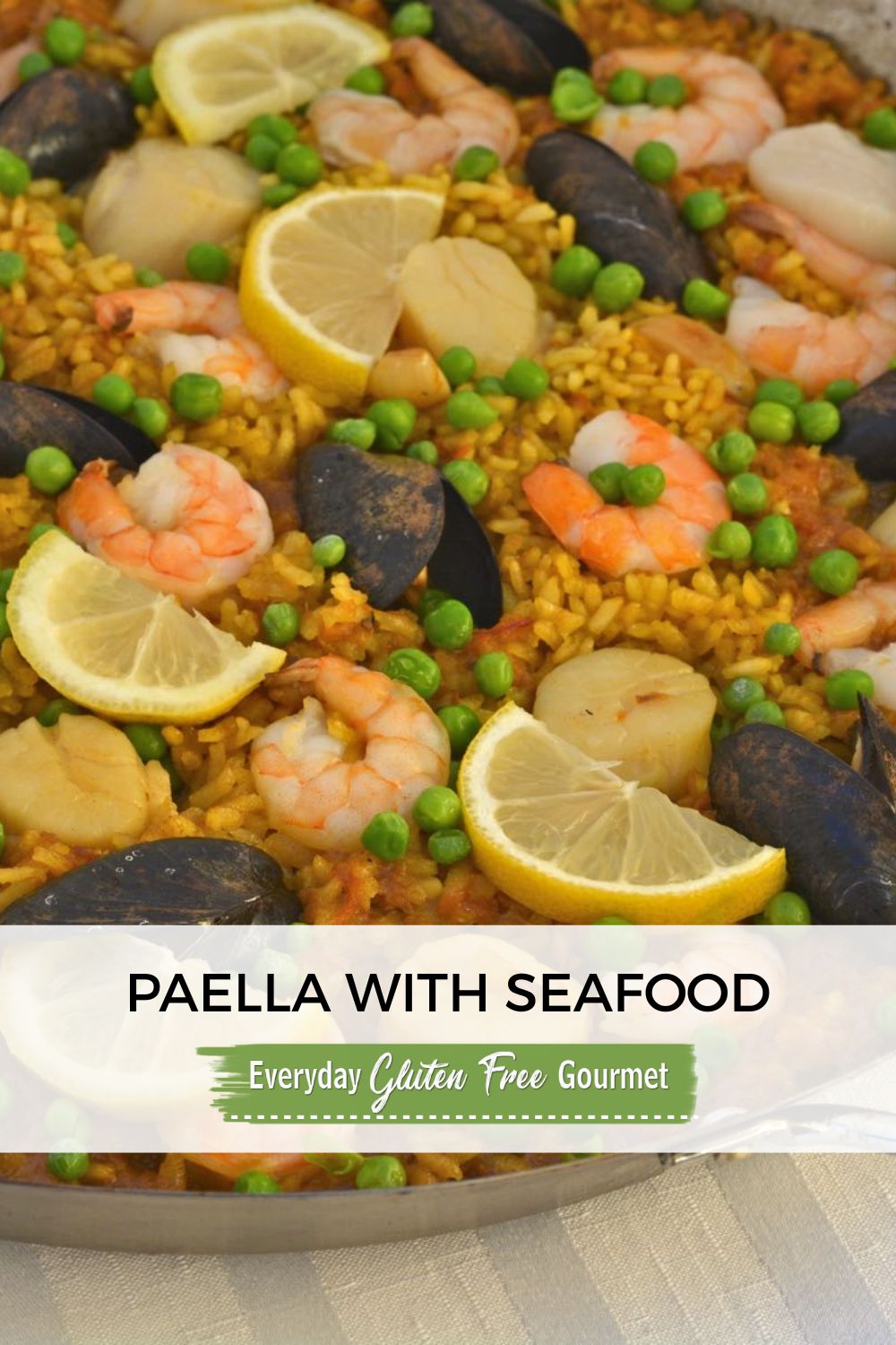 A paella pan filled with Paella with Seafood.