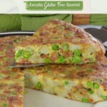 A single wedge being lifted from a whole Potato Chorizo Frittata.