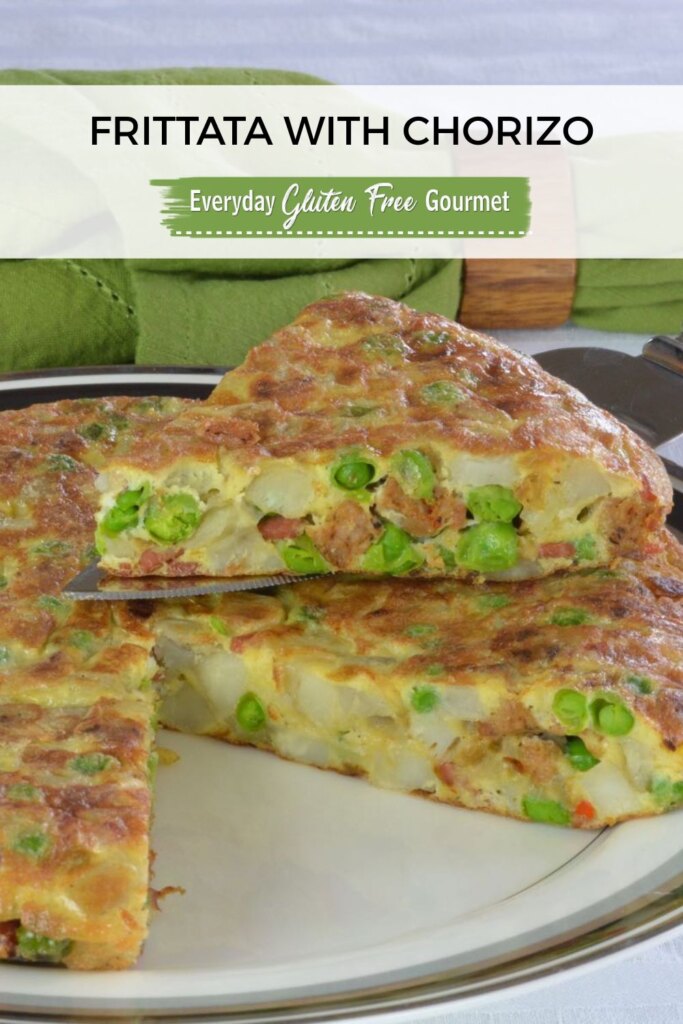 A single wedge being lifted from a whole Potato Chorizo Frittata.