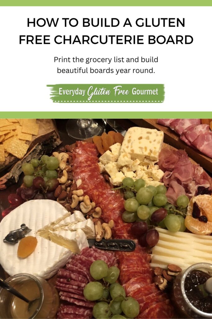 A gluten free charcuterie board with meat, cheese, nuts, fruit and gluten free crackers.