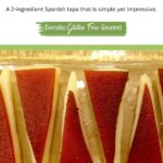 A rectangular platter with triangles of Manchego cheese covered with a slightly smaller triangle of Quince Paste.