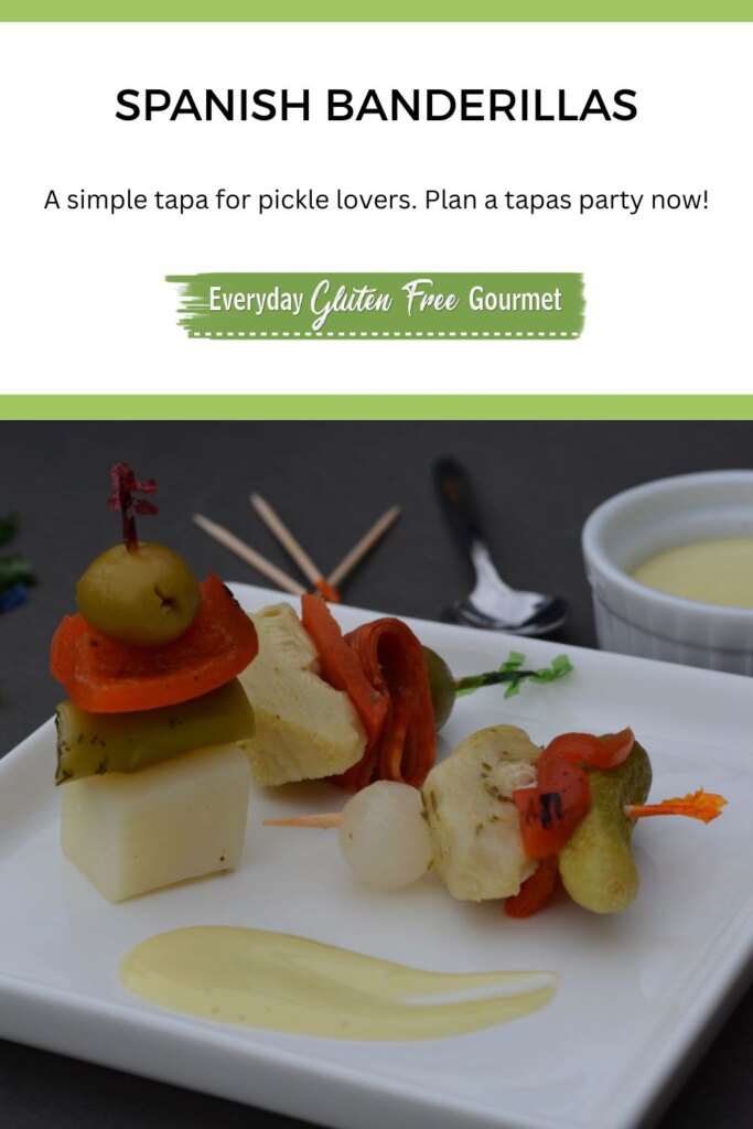 A plate with banderillas; toothpicks loaded with cold veggies (potato, olives, pickles, peppers and more) with a swipe of homemade mayo.